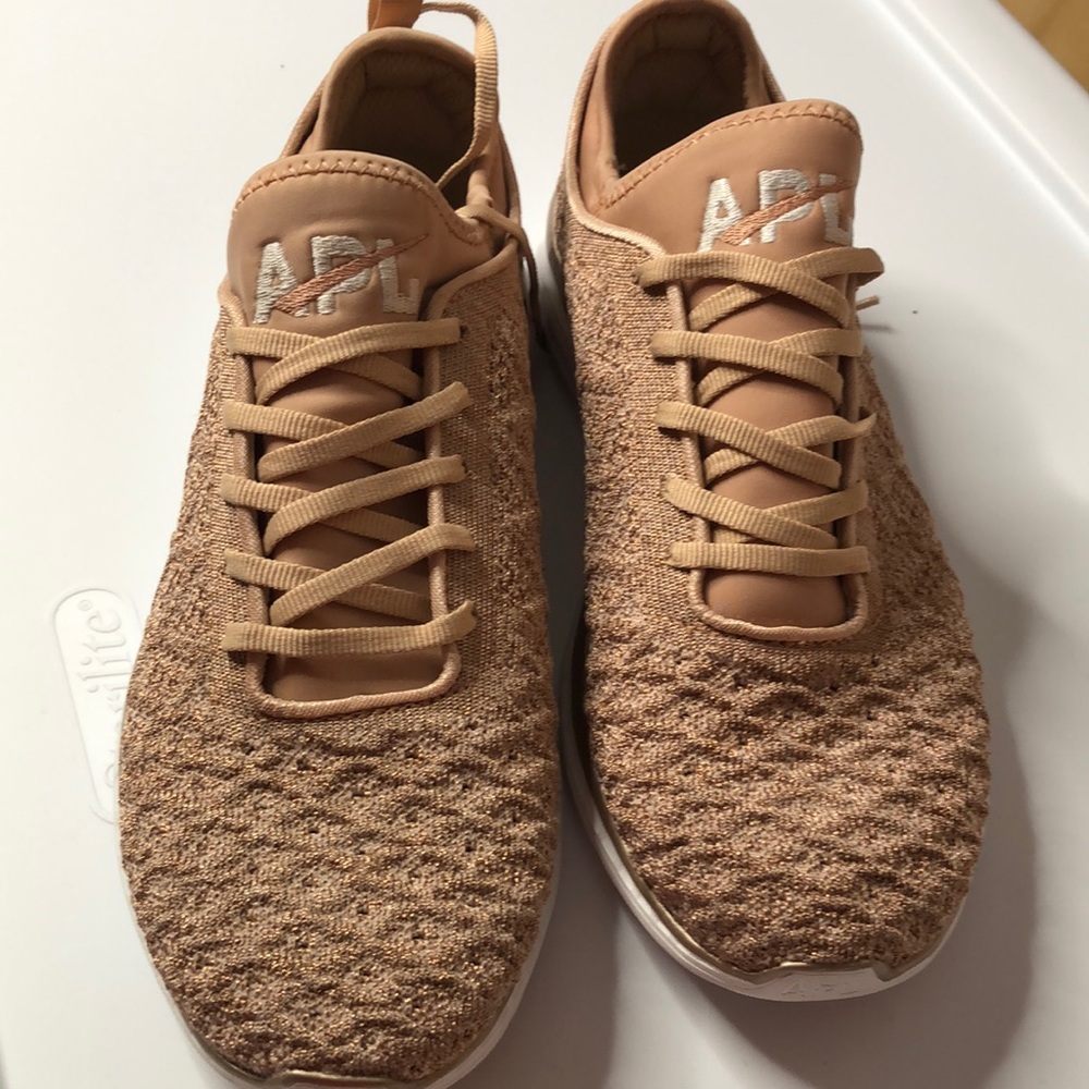 APL shoes in metallic pink